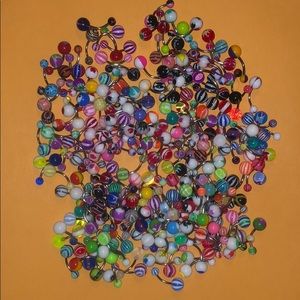 Lot of belly button rings unknown material